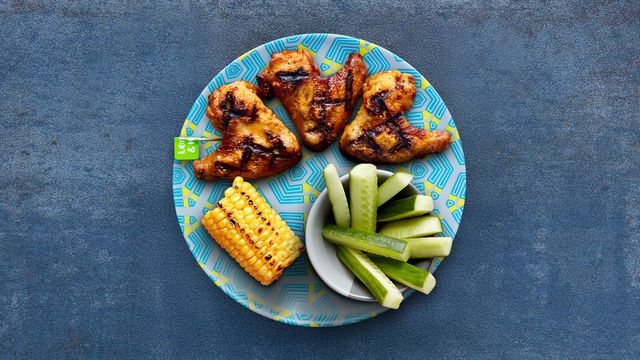 Nandinos 3 Chicken Wings with optional sides Corn on the Cob and Cucumber.