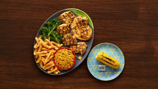 A Boneless Platter with optional sides Long Stem Broccoli, Creamy Mash, Spicy Rice and Corn on the Cob