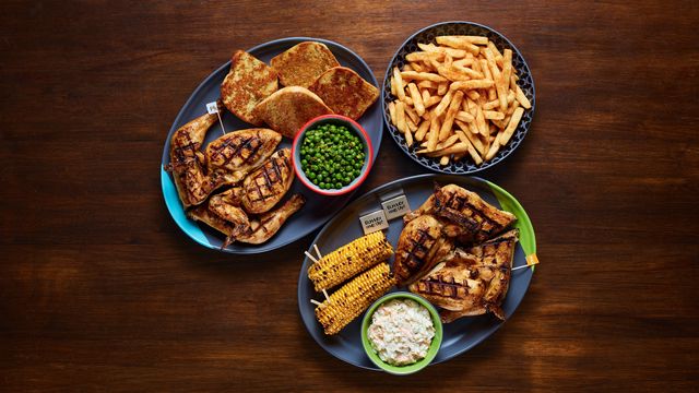 A Family Platter with optional sides Garlic Bread, Macho Peas, PERi-Salted Chips, Corn on the Cob and Coleslaw