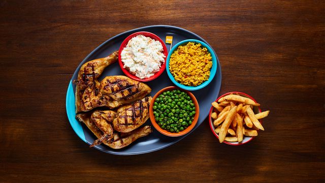 A Full Platter with optional sides Coleslaw, Spicy Rice, Macho Peas and PERi-Salted Chips